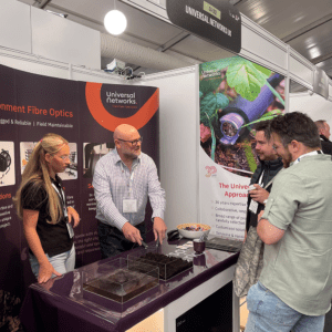 Visitors watching demonstration on exhibition stand